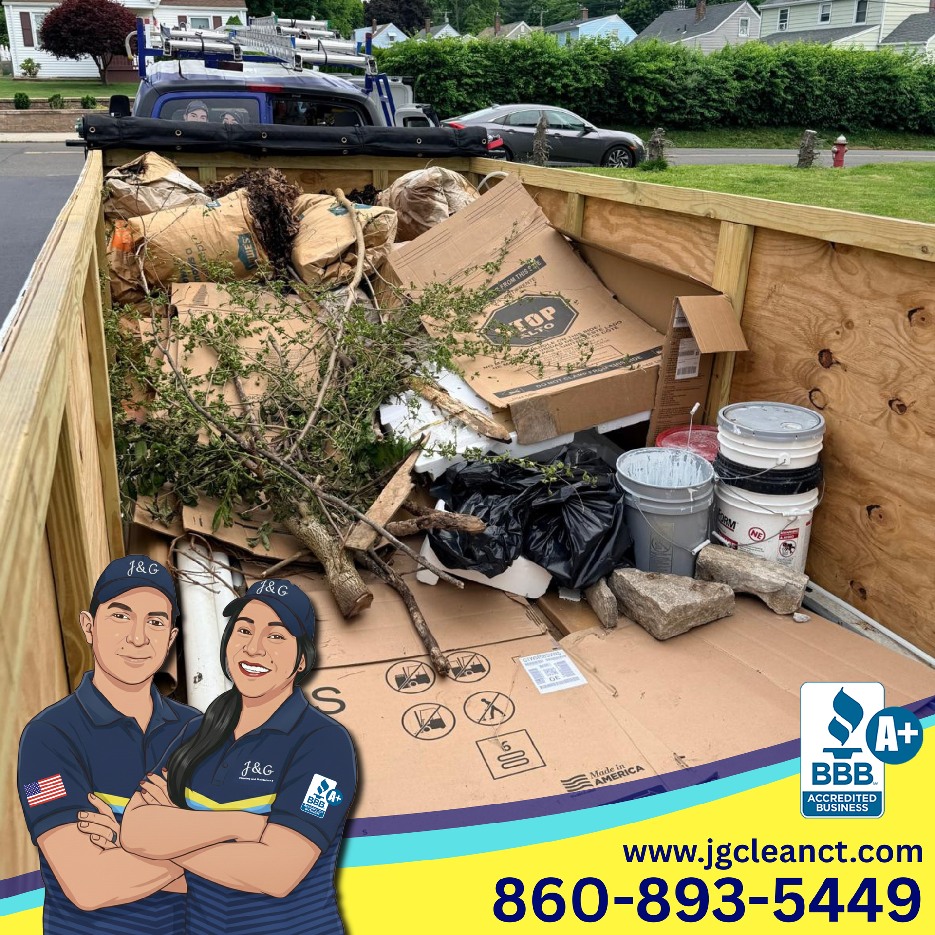 Open truck bed filled with cardboard, trash, and buckets parked on a residential street