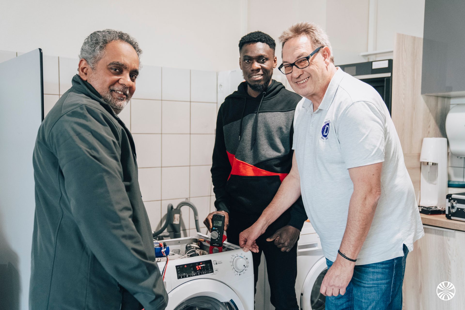 Photo de 3 apprenants de la Formations Réparation et Maintenance
