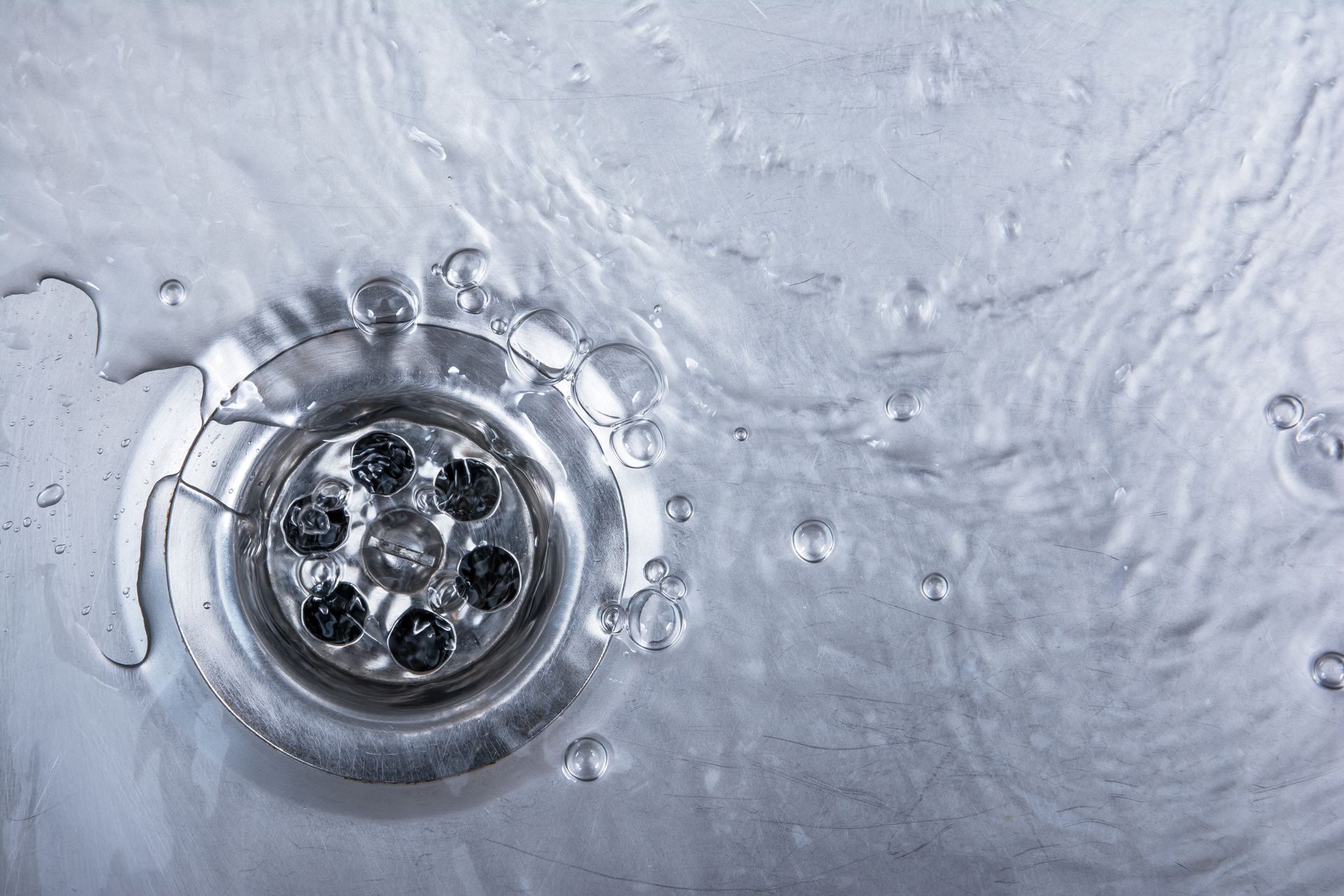 sink drain with water flowing