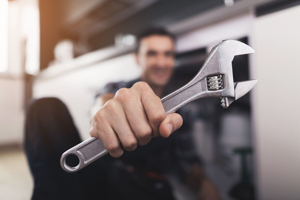 plumber holding a wrench