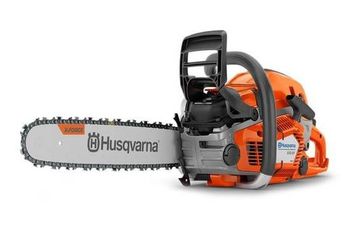 Husqvarna chainsaw in orange and gray, ready to cut wood.