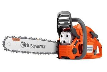 Orange Husqvarna chainsaw on a white background.