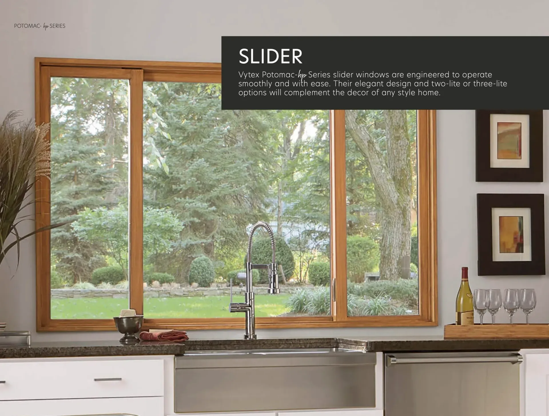 Kitchen window with a wooden sliding pane overlooking a green yard, with sink and countertop below