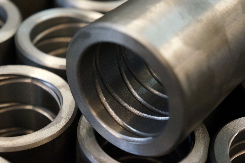 A Bunch Of Metal Cylinders Are Stacked On Top Of Each Other — D.E.M Solutions Pty Ltd In Caboolture, QLD