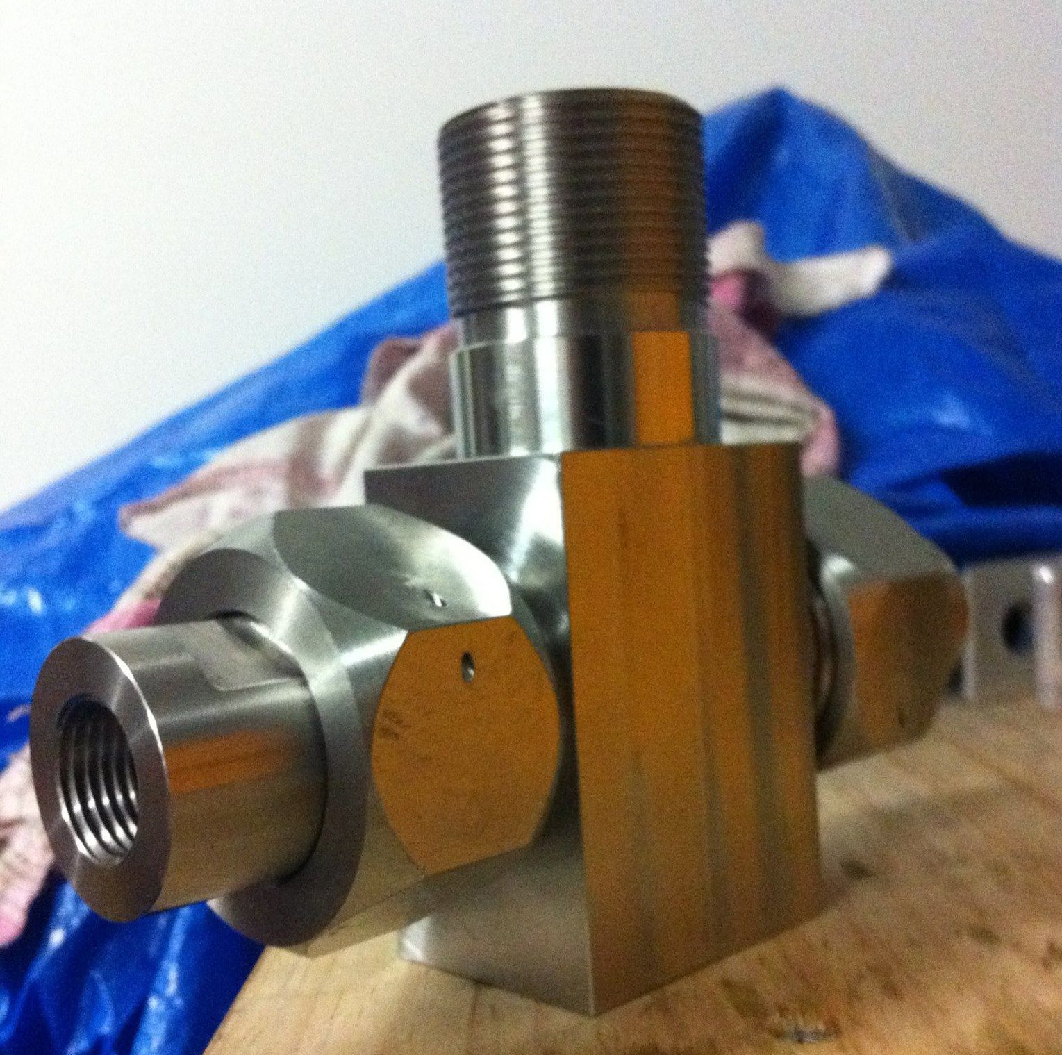 A Close Up Of A Metal Object With A Blue Tarp In The Background — D.E.M Solutions Pty Ltd In Caboolture, QLD