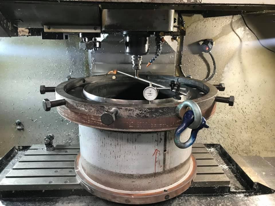 A Machine Is Cutting A Piece Of Metal On A Table — D.E.M Solutions Pty Ltd In Caboolture, QLD