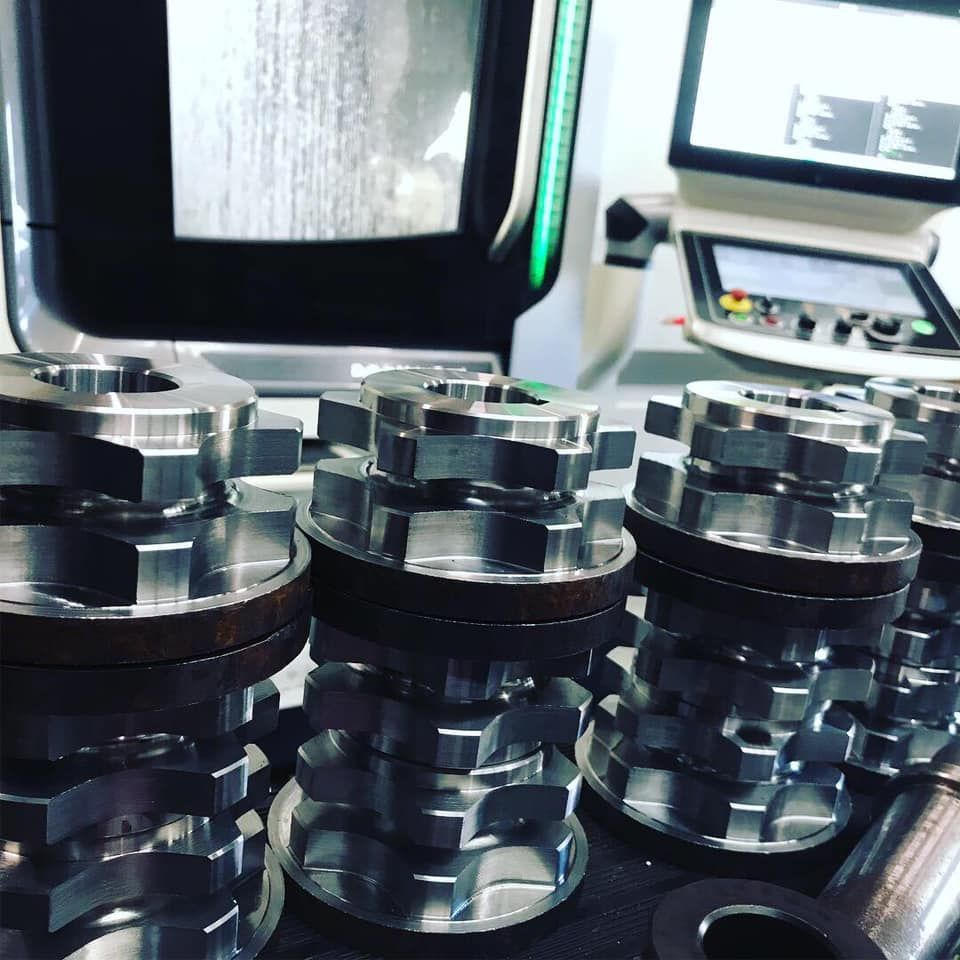 A Bunch Of Metal Gears Are Stacked On Top Of Each Other — D.E.M Solutions Pty Ltd In Caboolture, QLD