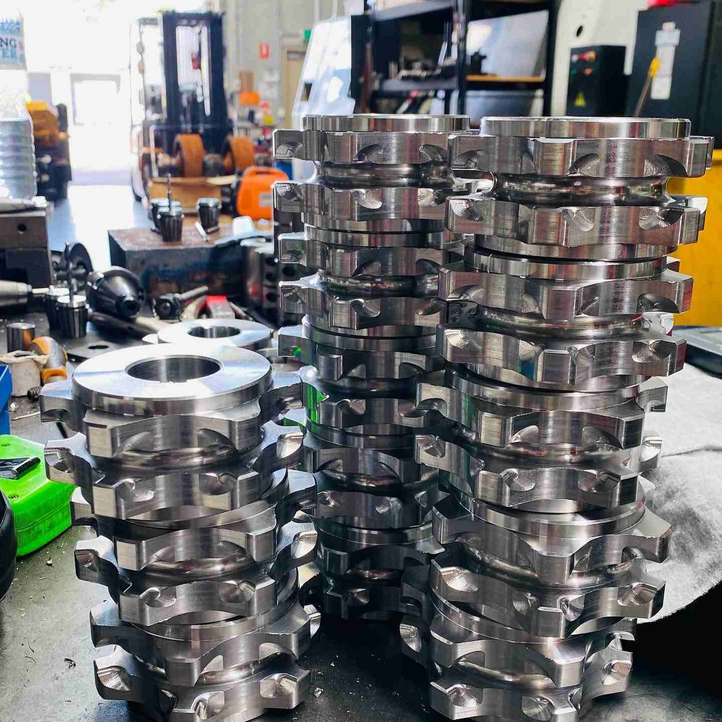 A Bunch Of Metal Gears Are Stacked On Top Of Each Other — D.E.M Solutions Pty Ltd In Caboolture, QLD