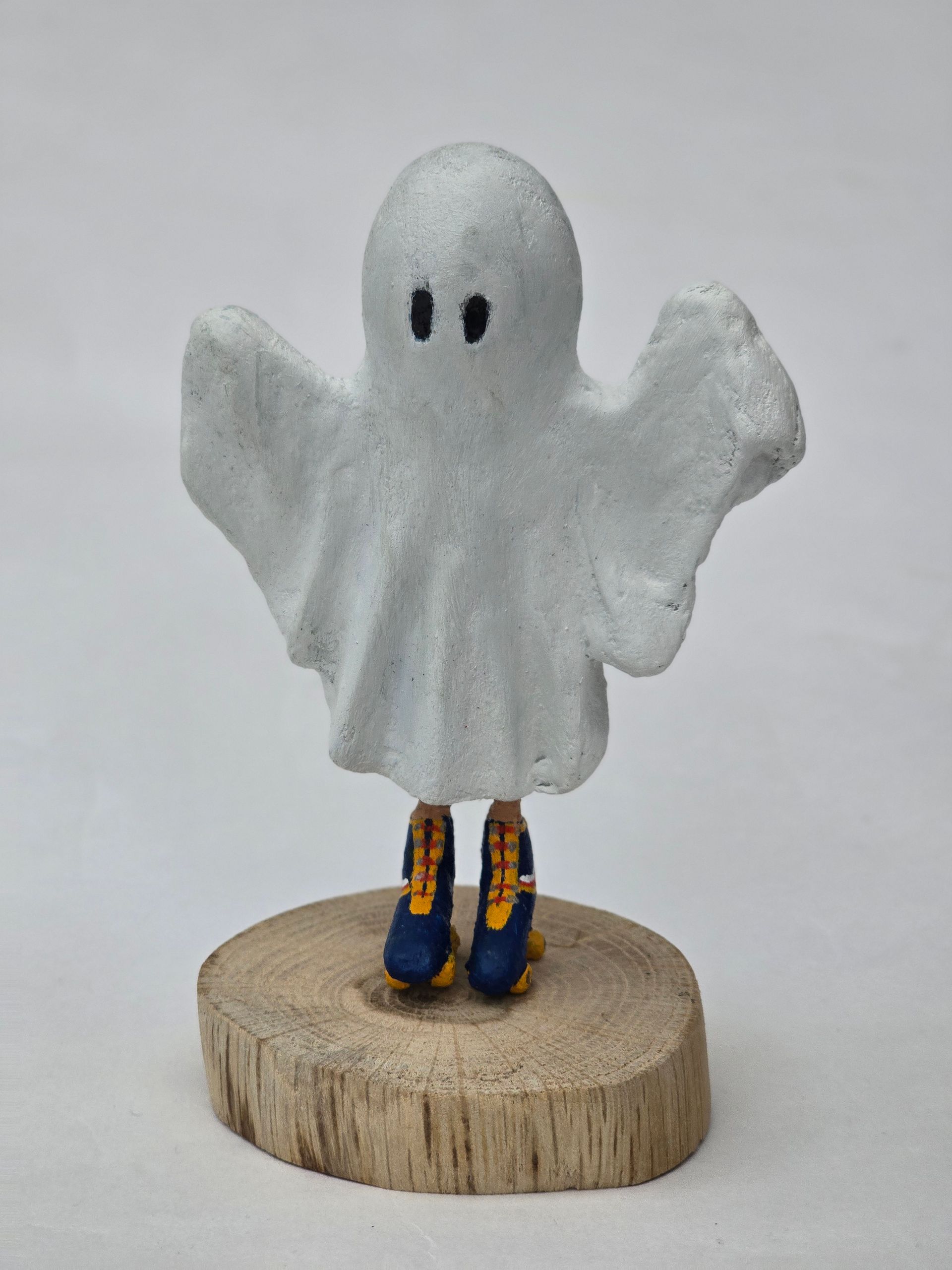 Paper mache ghost on retro rollerskates