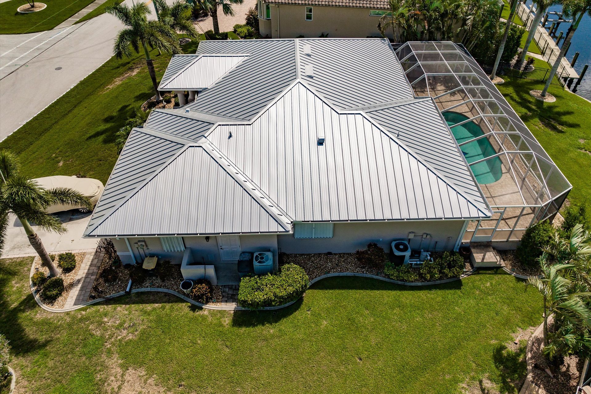 Florida canal home — complex hip and valley standing seam roof