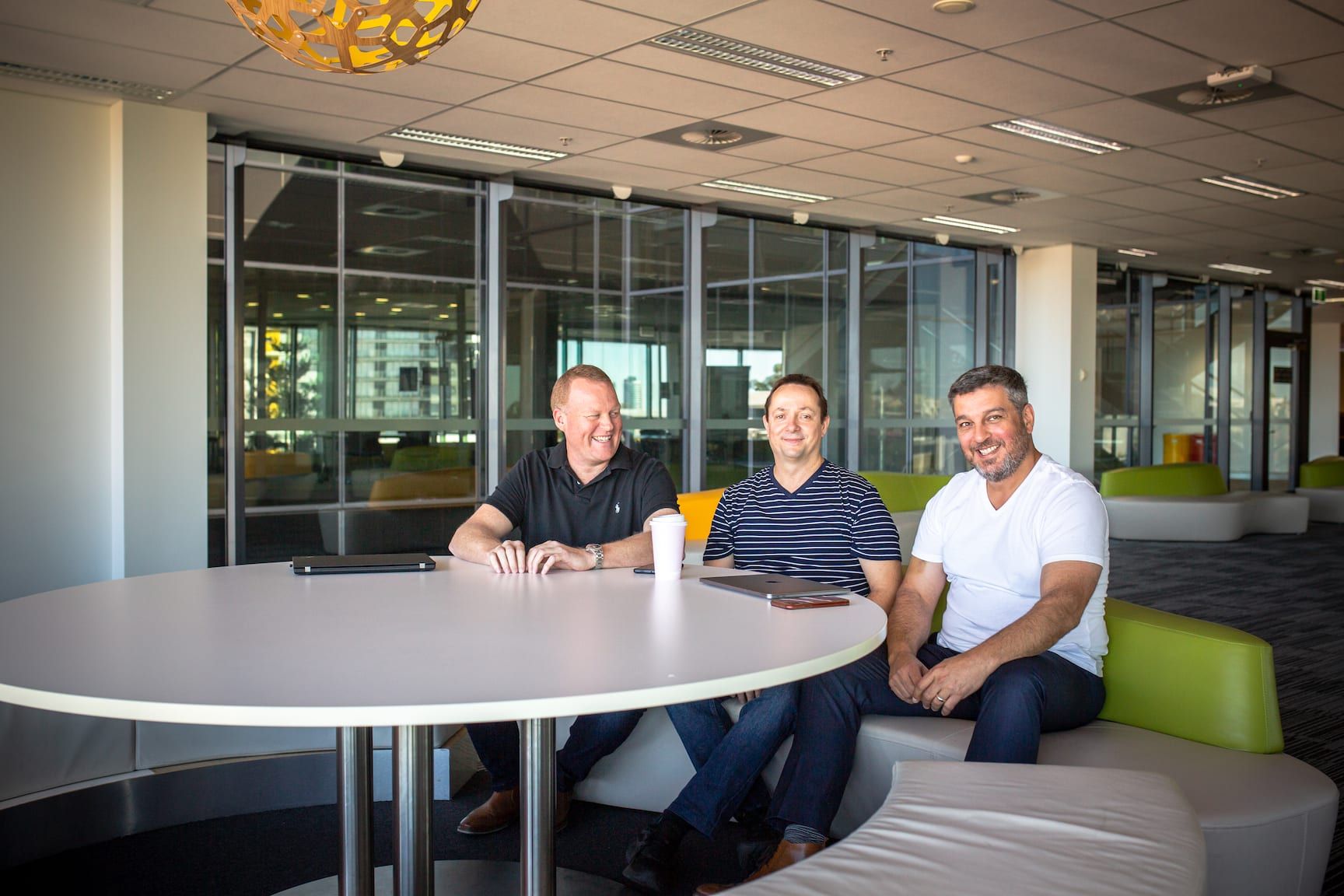 3 men sitting