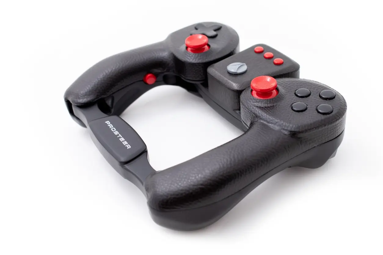 A black video game controller with red buttons on a white background
