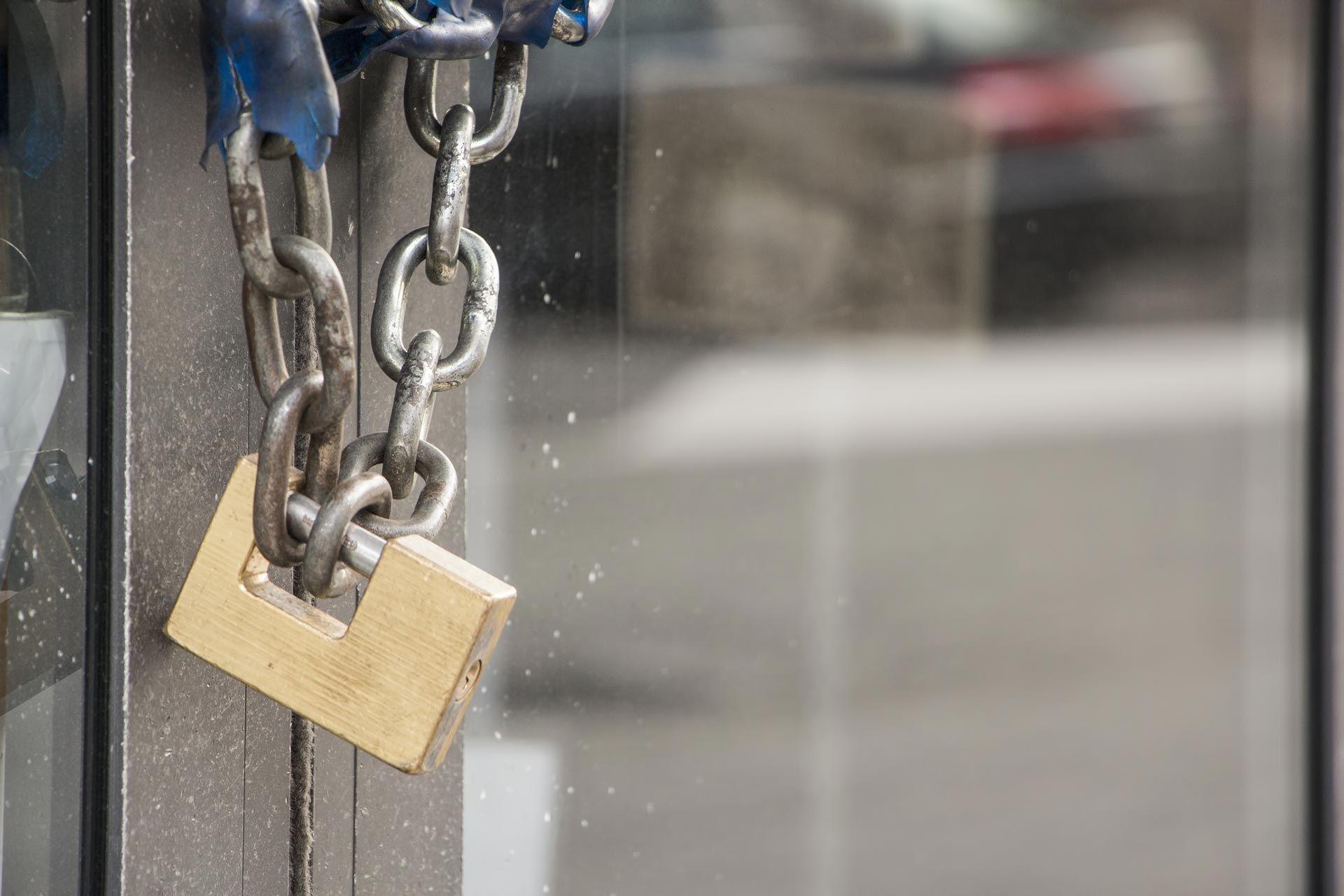 A Door Is Locked With A Padlock And Chains — Eddie Williams Locksmiths in Cairns City, QLD