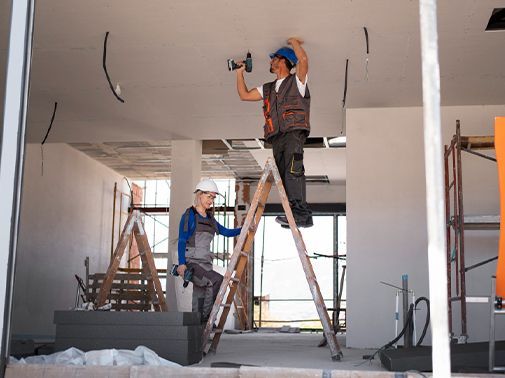 A kitchen with wooden cabinets and stainless steel appliances