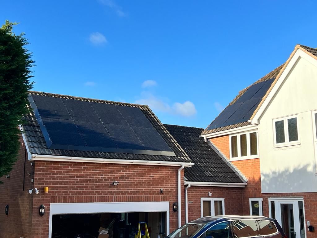 Newly installed solar panels on a garage roof