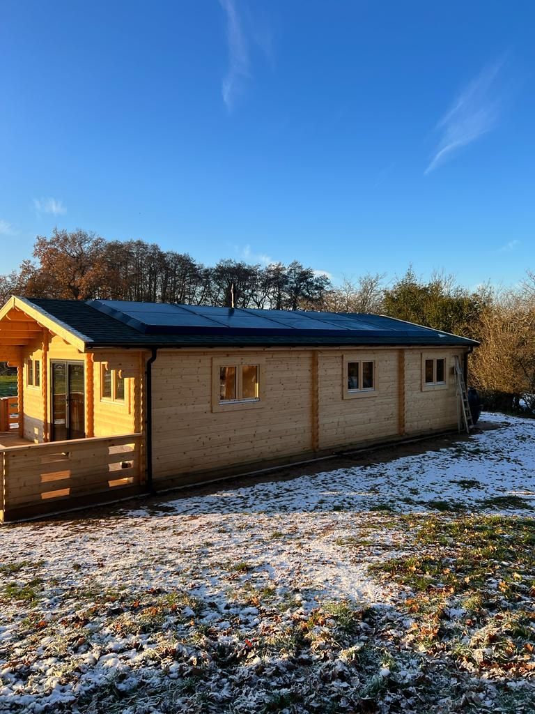 Solar panel installation on a wooden building