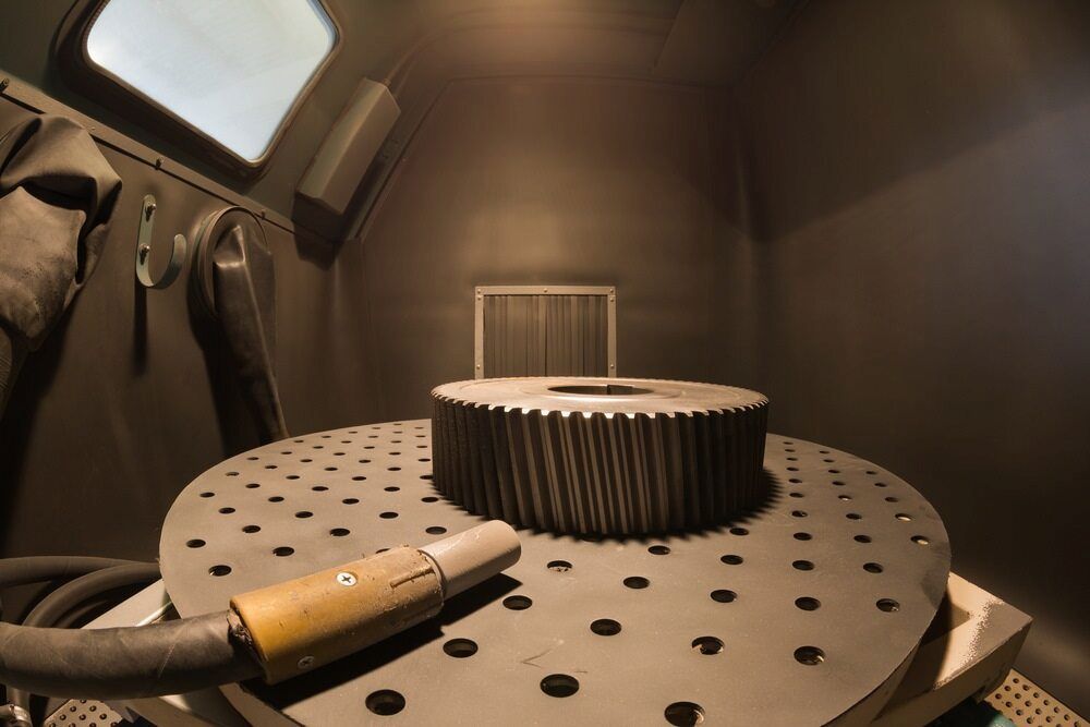A Large Gear is Sitting on a Table in a Room — Mudgee Powder Coat Pty Ltd in Mudgee, NSW