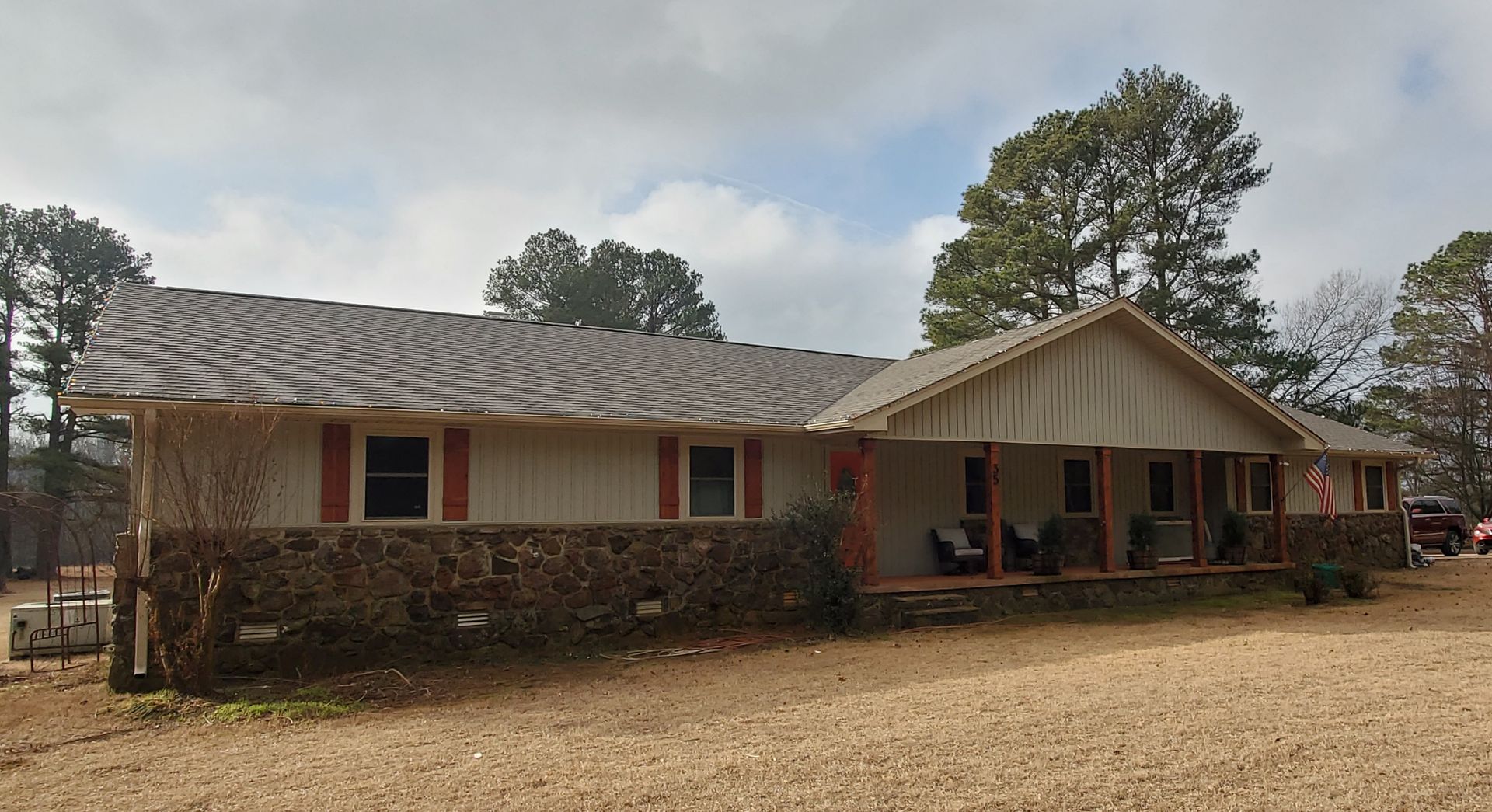 Atlas Pinnacle Pristine architectural in Weathered Wood. Mastic Board & Batten vinyl siding in Tuscan Olive. 5” seamless gutters, downspouts, and all trim in Wicker