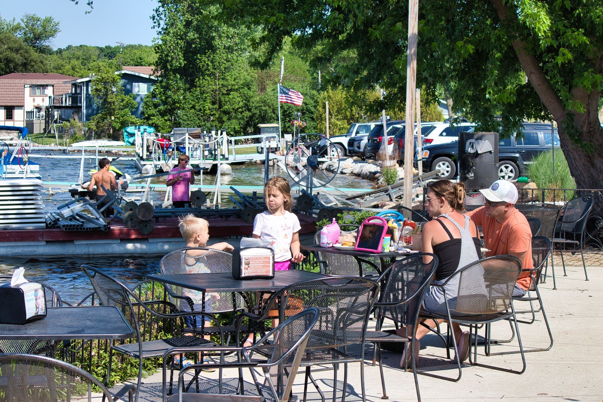 Guests seated on the patio near Silver Lake docks.