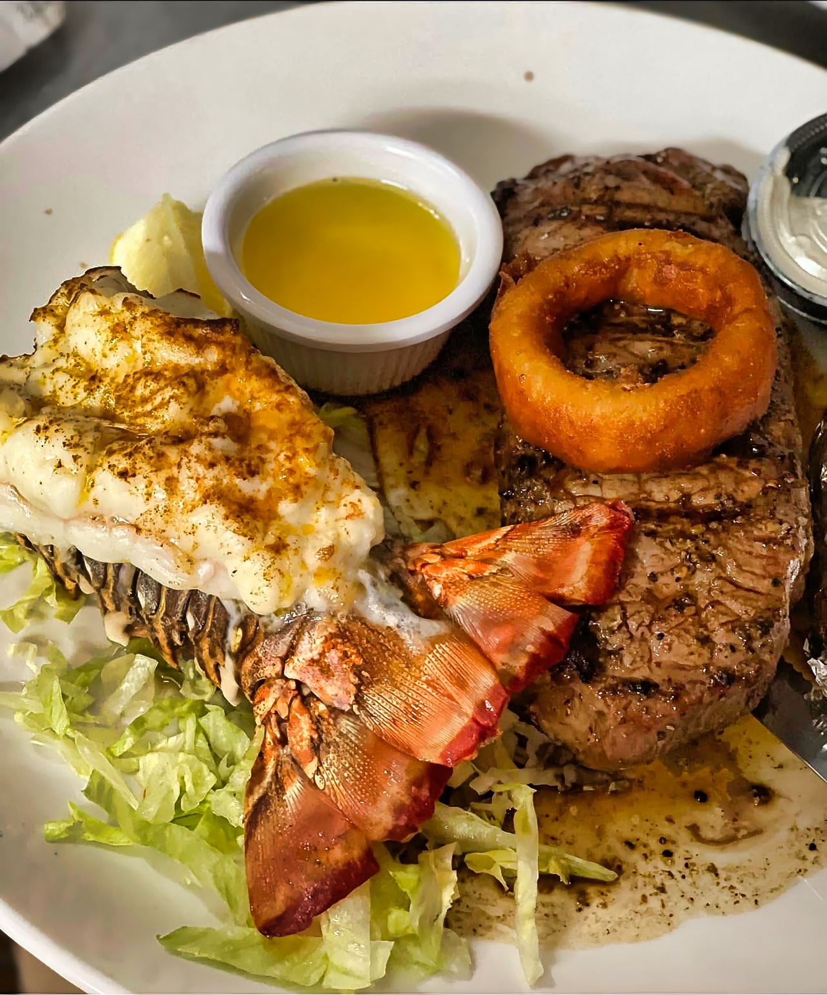Surf and turf dinner with steak and lobster tail.