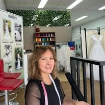Measuring the waist of a white lace bridal dress with a tape measure Measuring the waist of a white lace bridal dress with a tape measure