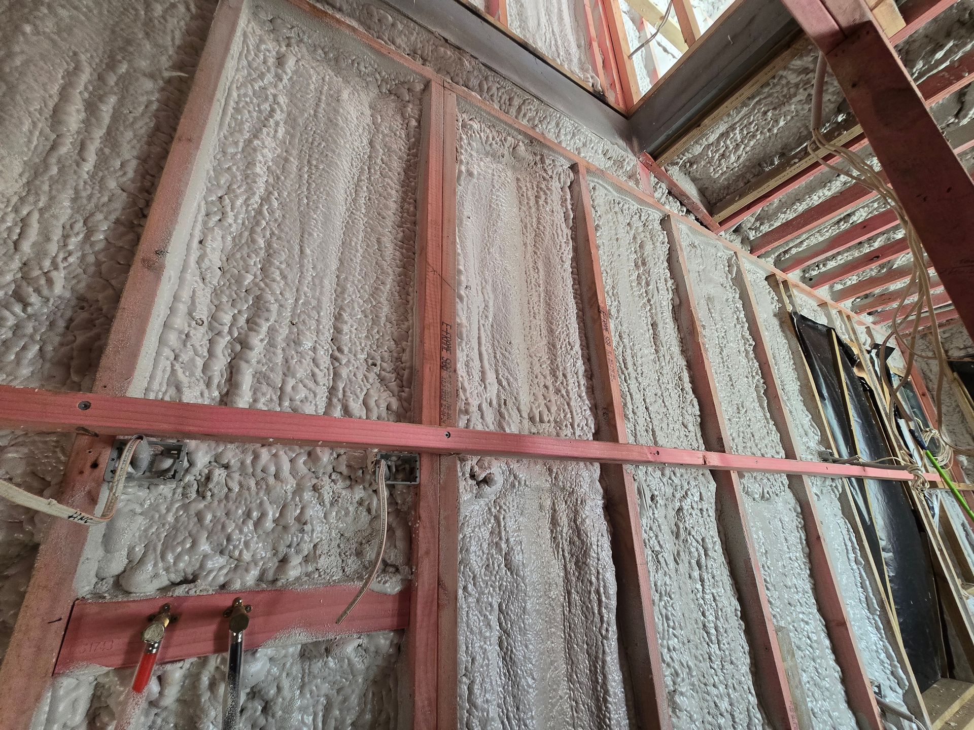 A building under construction with foam on the walls and ceiling.