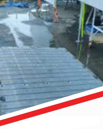 A wooden deck with a red and white stripe on the bottom.