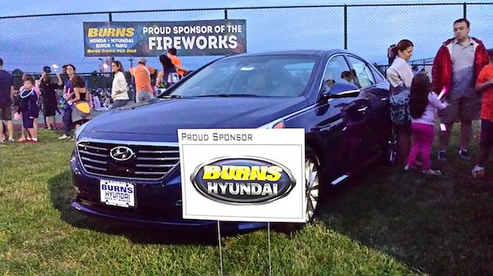 Burns Hyundai sign at a local fireworks show