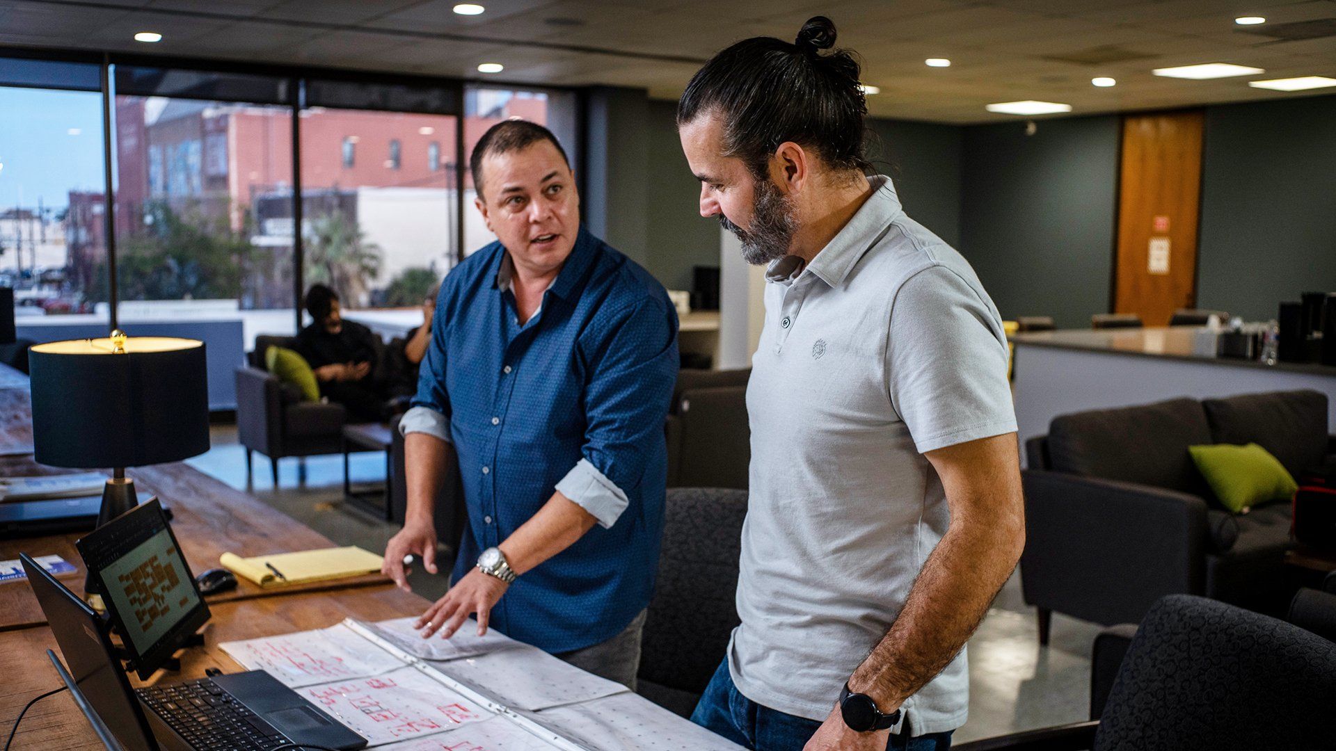 2 men at a desk