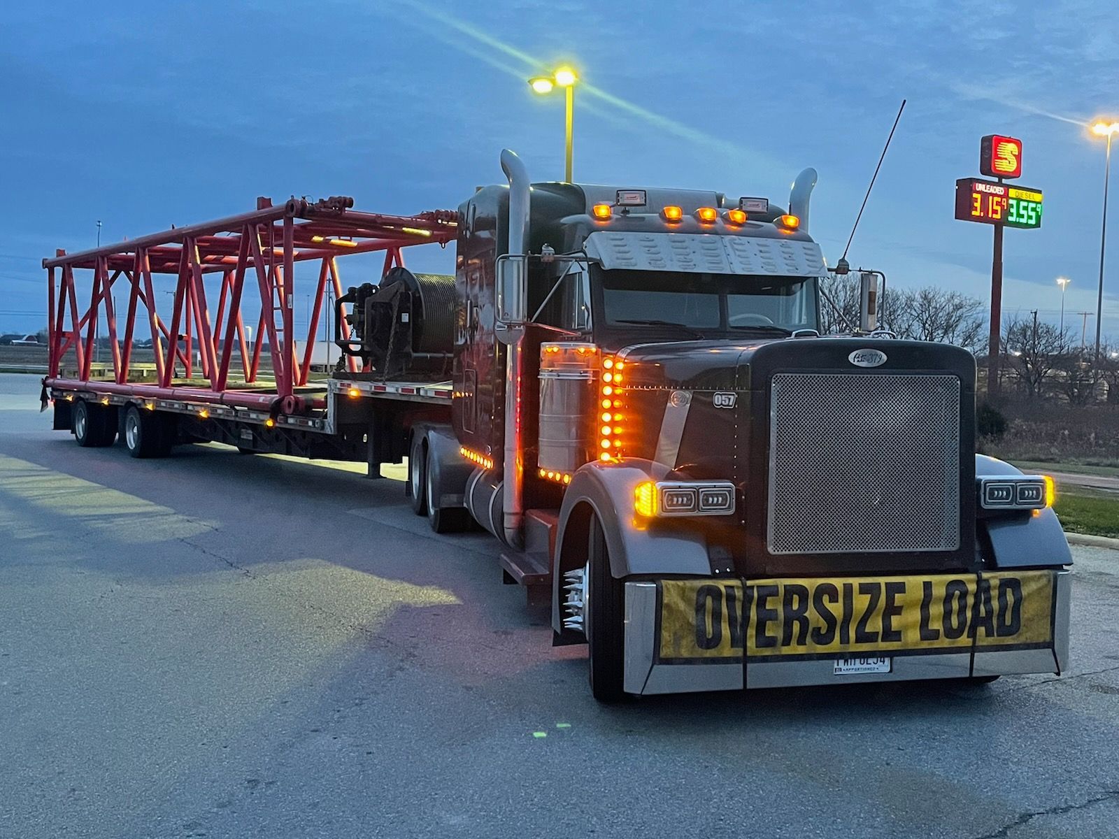 An oversize load truck is driving down the road