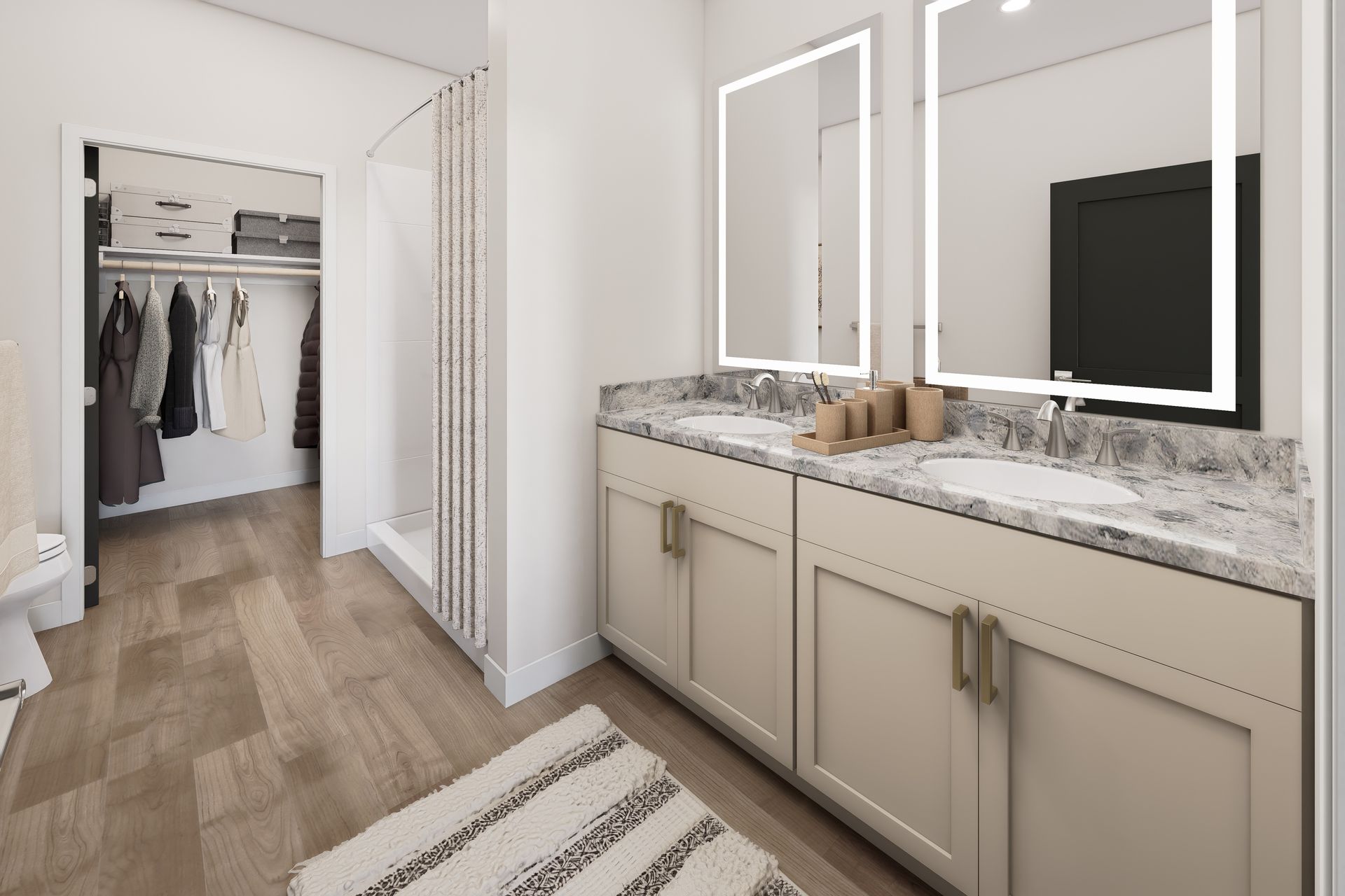Bright modern bathroom with double vanity, large mirrors, and walk-in closet visible in the background