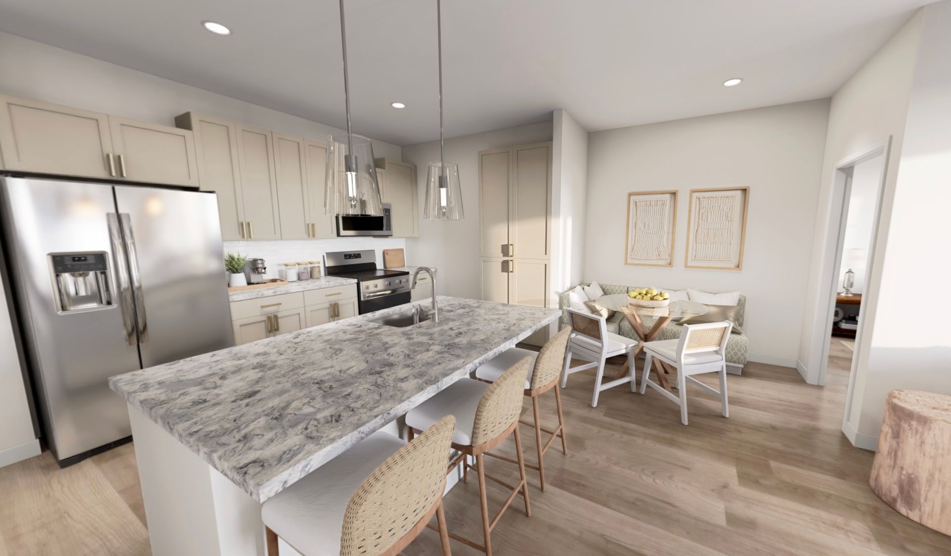 Bright modern kitchen and dining area with a large marble island, stainless fridge, and white chairs