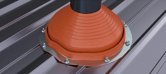 Close-up of an orange corrugated metal roof with blue sky in the corner