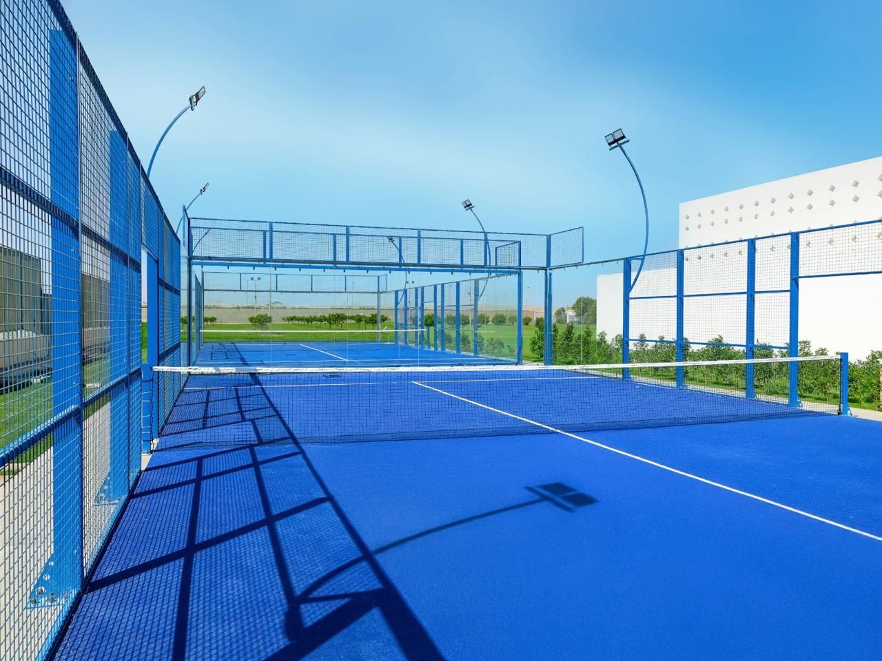 Outdoor paddle court facilities at Palm Royale Resort Soma Bay