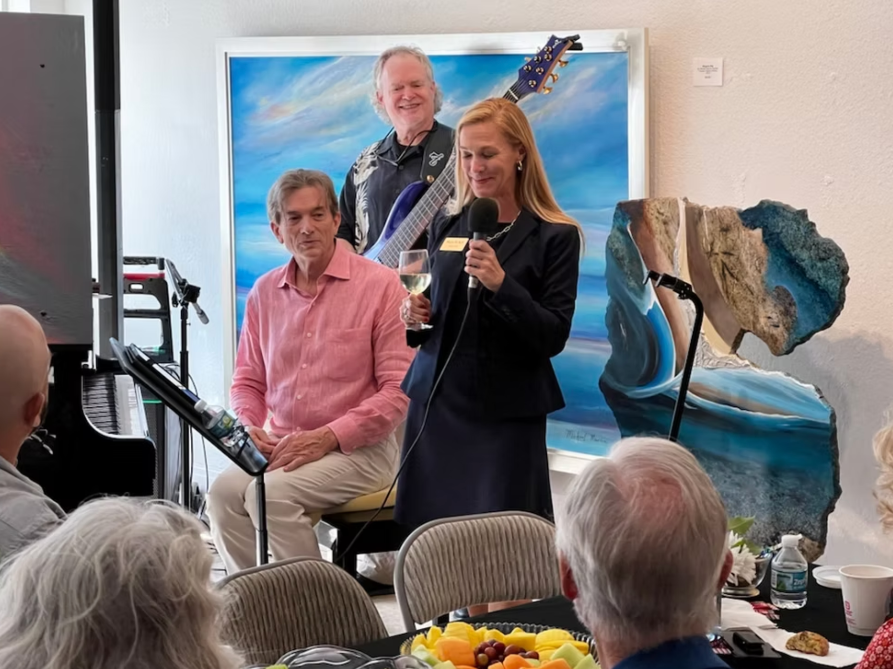 Woman speaks into a microphone