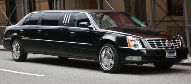 Black stretch limousine parked on a city street