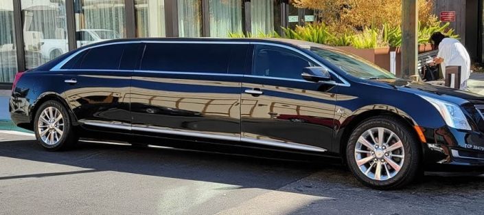 Black stretch limousine parked on a city street