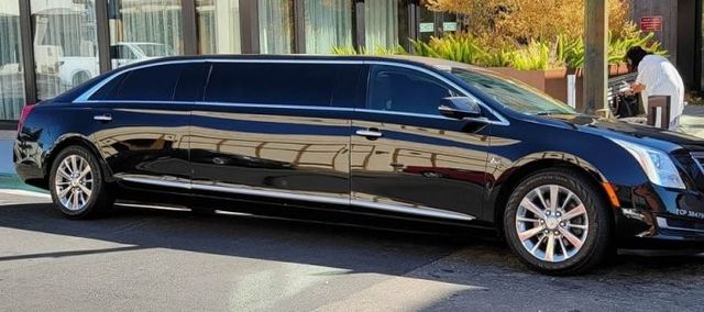 Black stretch limousine parked on a city street