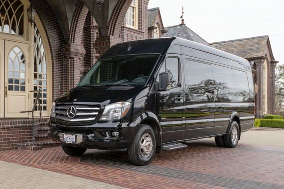 Black Mercedes-Benz cargo van on a white background