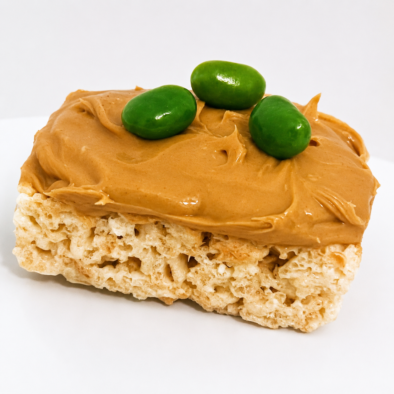 Photo of rice crispy treat with peanut butter and jelly beans to represent skin.