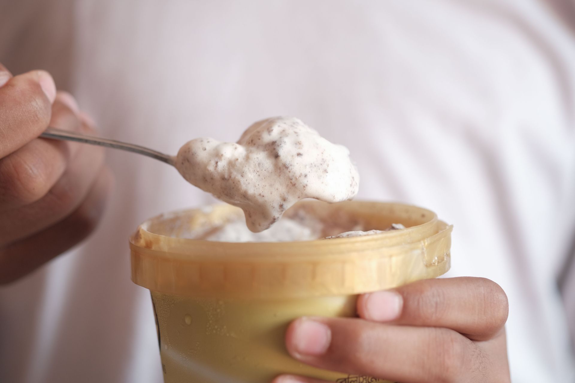 A child eating ice cream after making it.