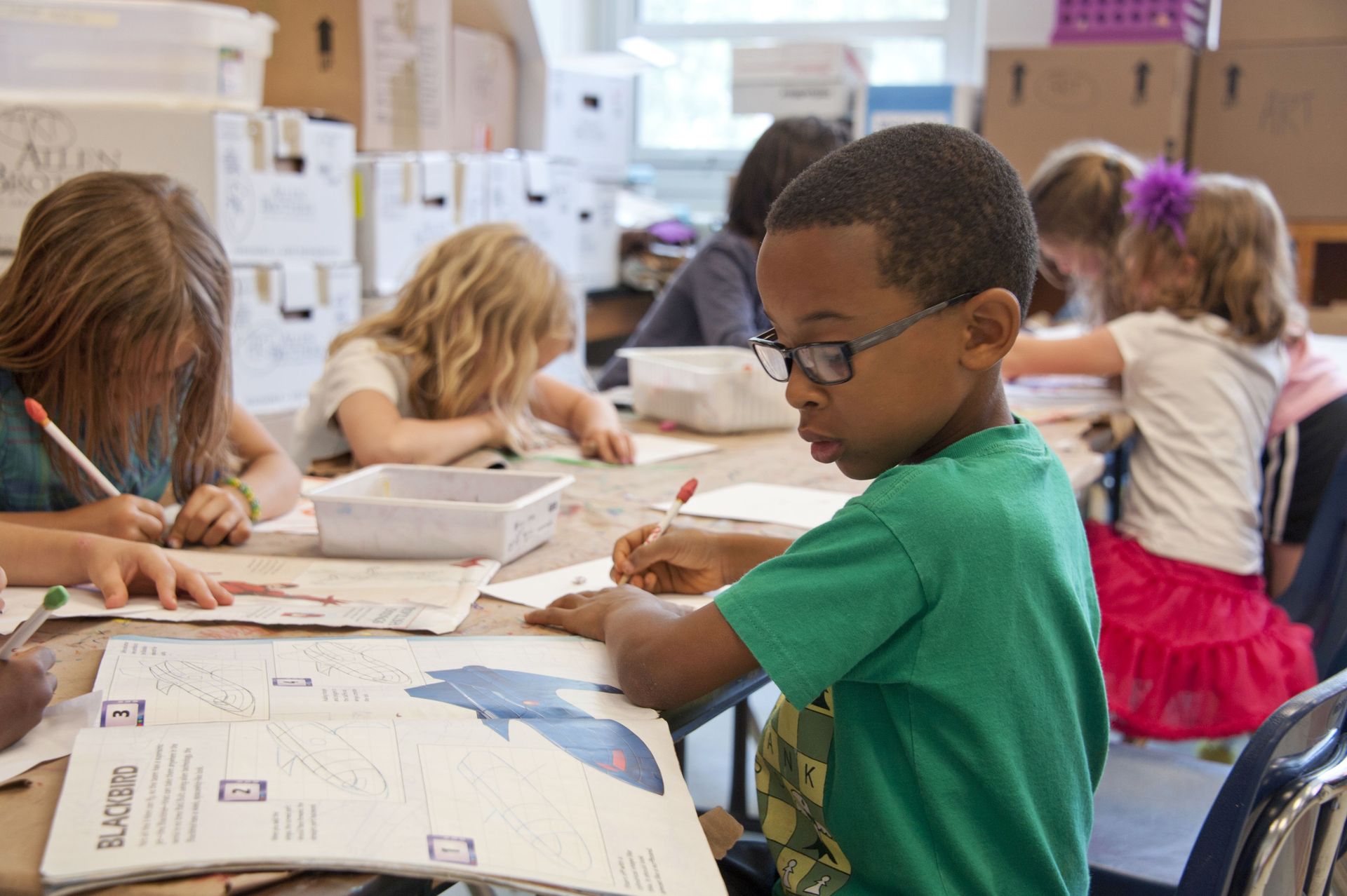 Students working in a classroom on reading skills.