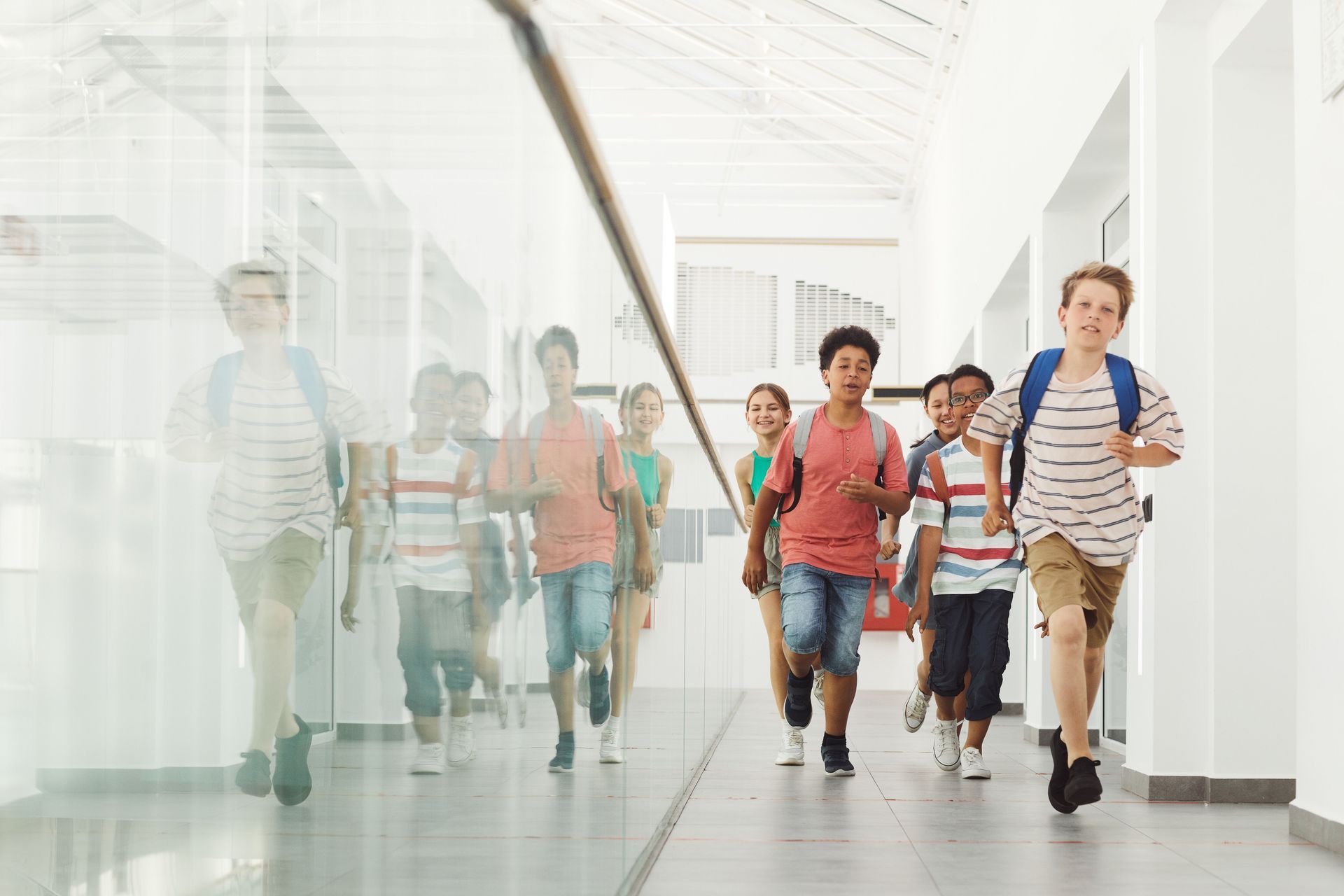Students exploring their school during a science scavenger hunt to find real-world examples