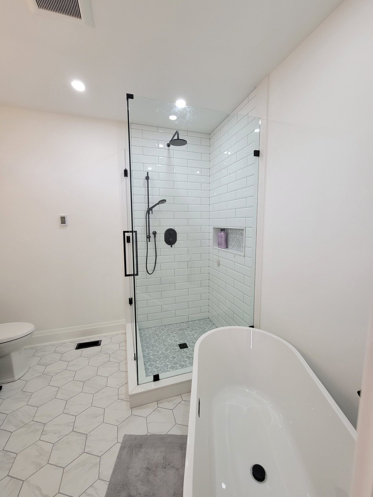 custom glass shower white subway tile