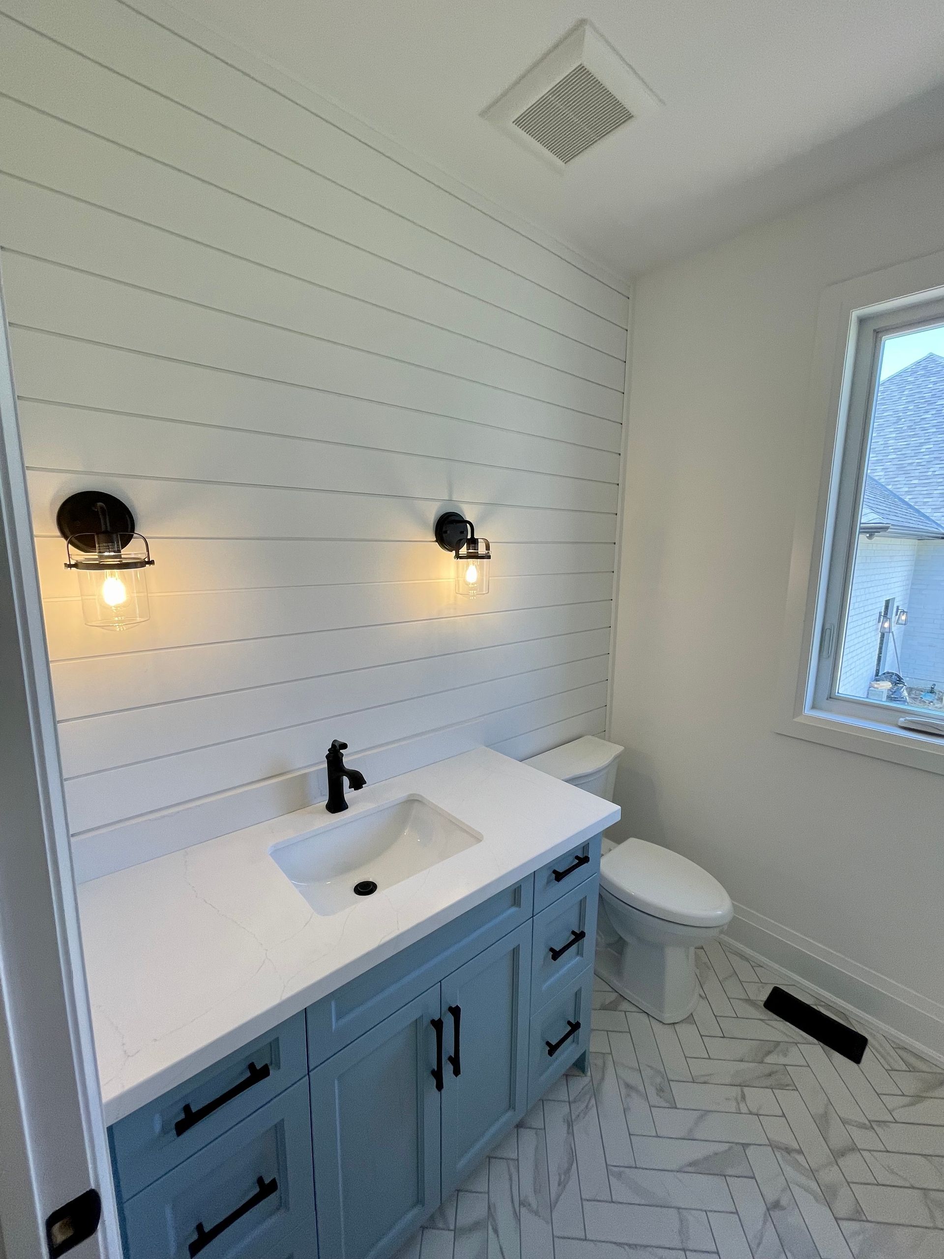 powder room washroom with shiplap wall
