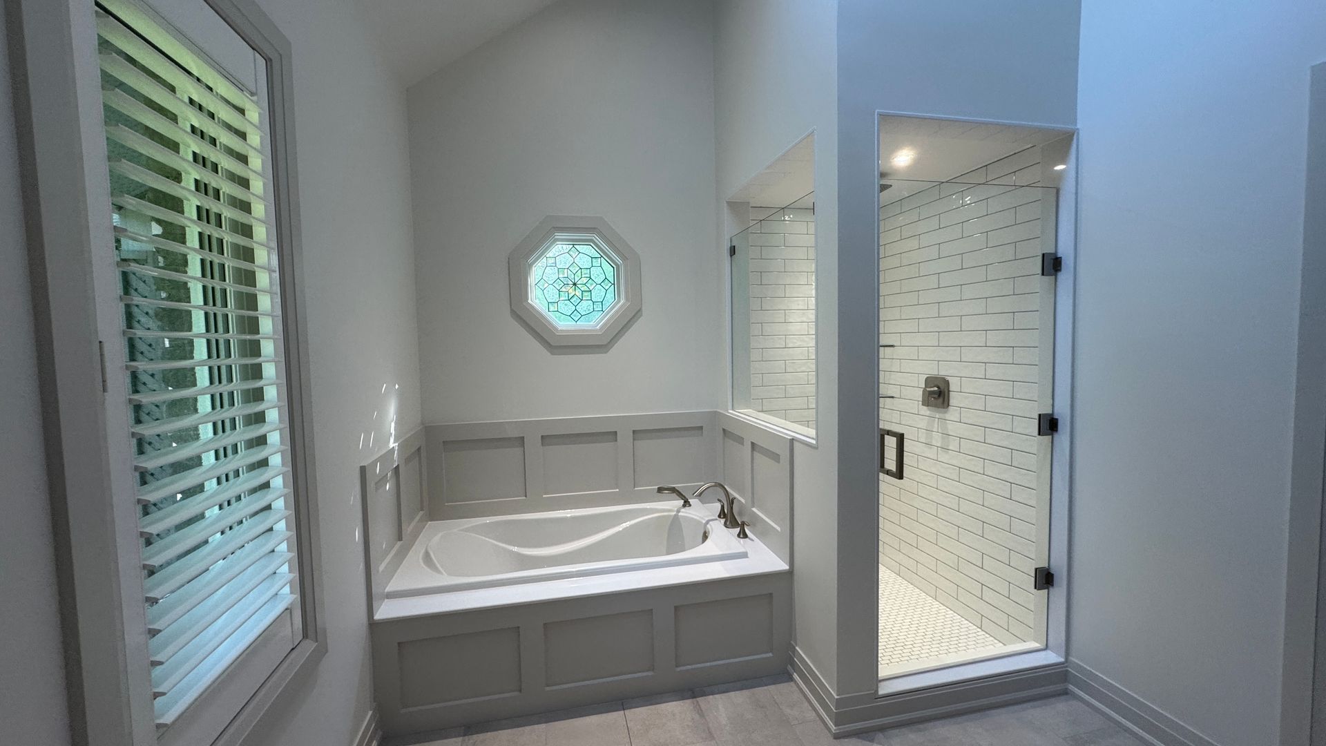 ensuite tub and custom glass shower with glass door and glass window ensuite soaker tub with custom panelling