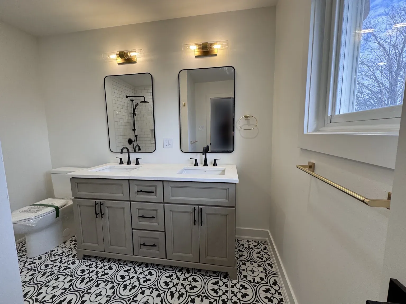 Moroccan tile bathroom with gray double vanity