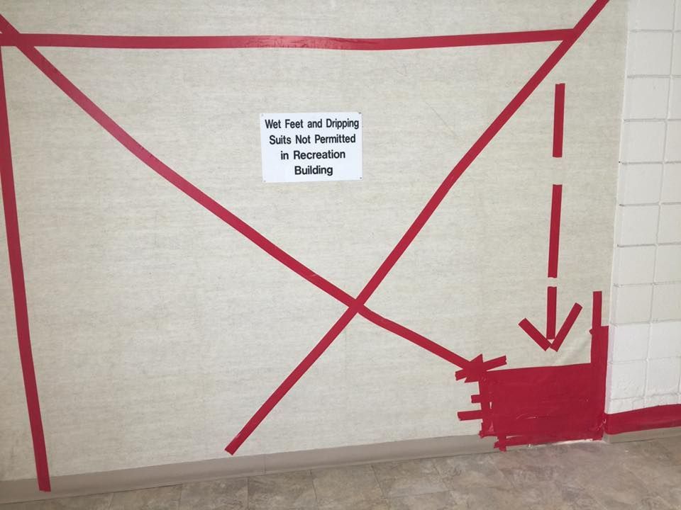 Sign on wall: 