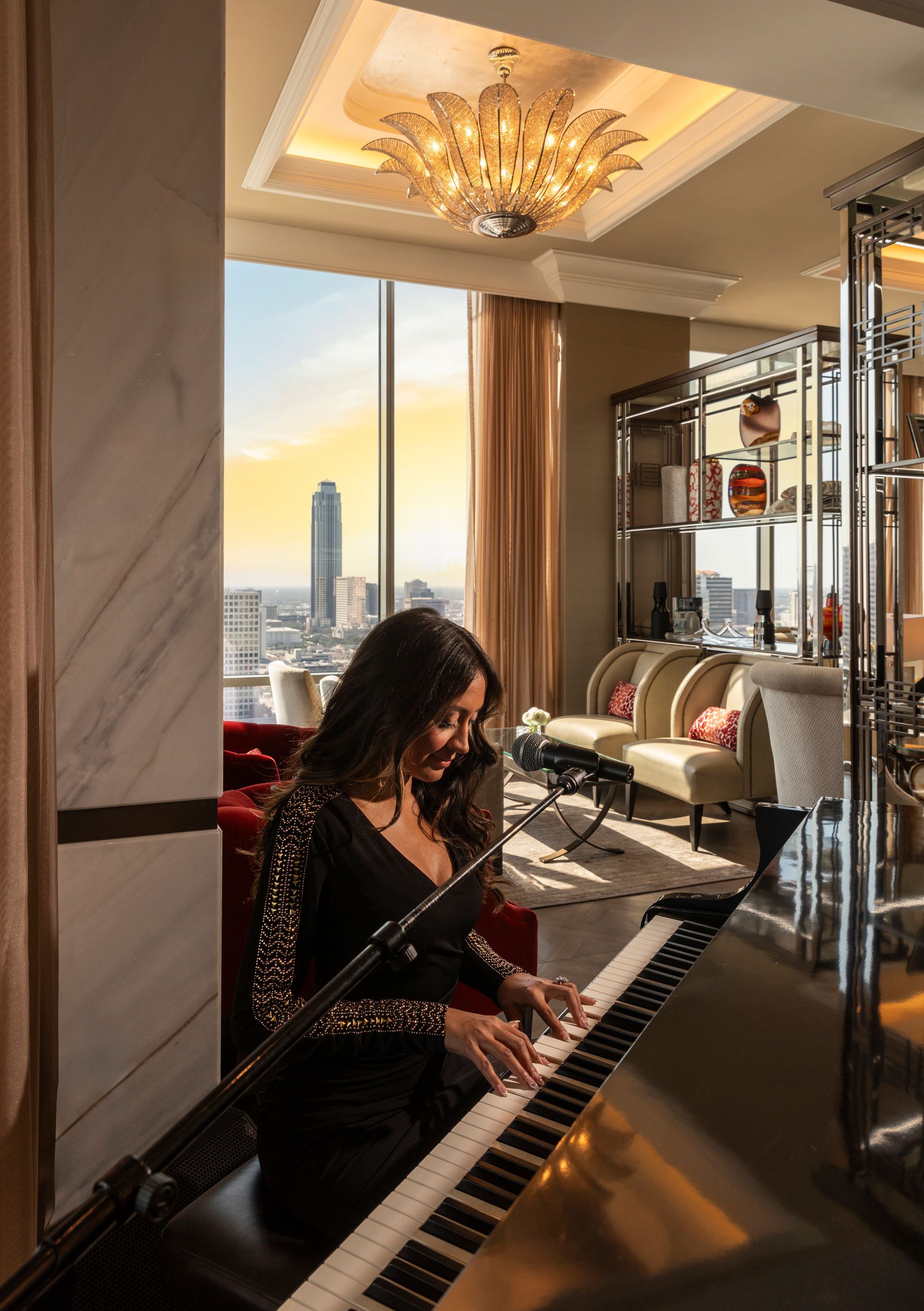 woman standing in front of window looking at the building view