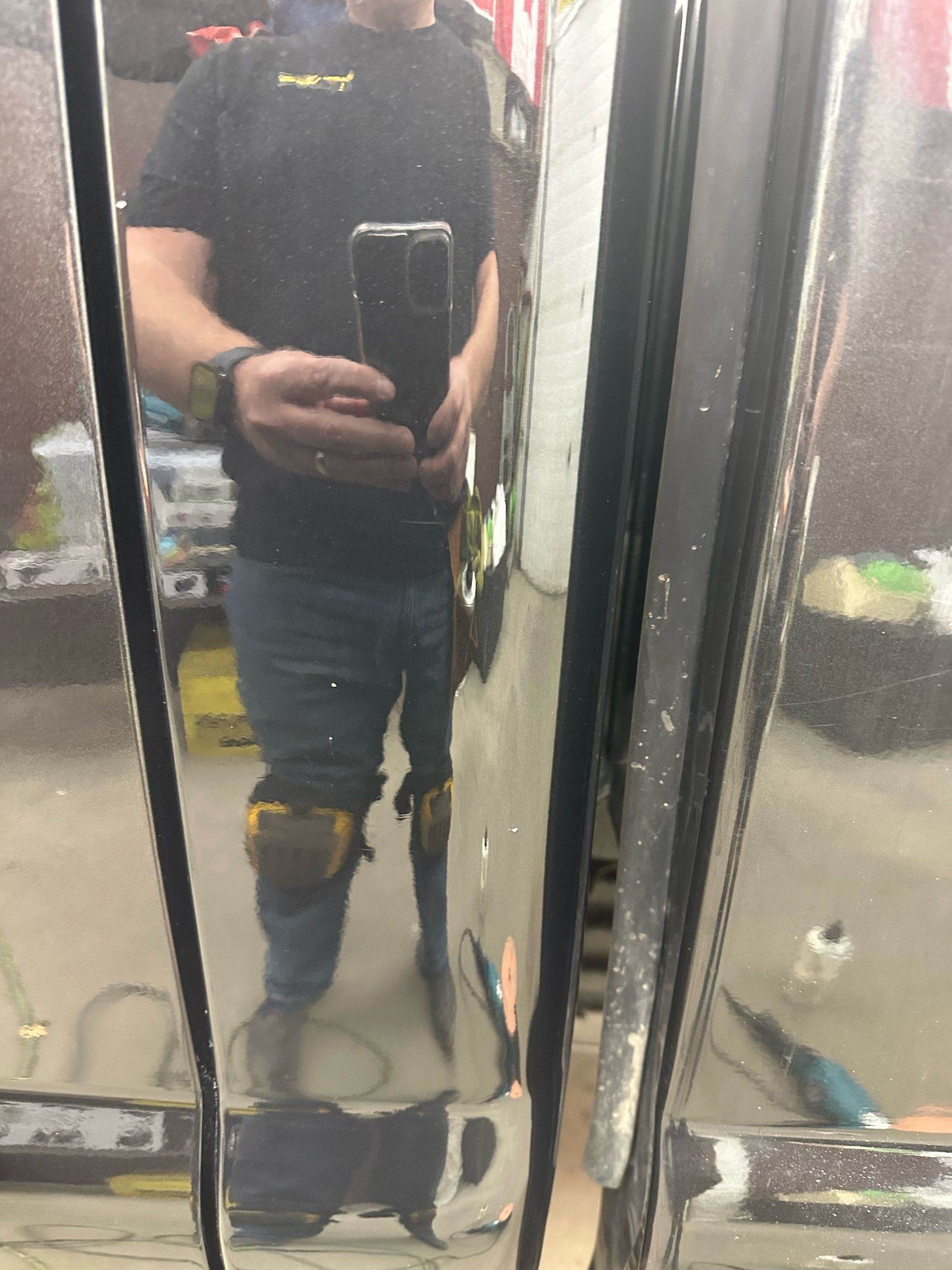 A man is taking a picture of himself in a mirror